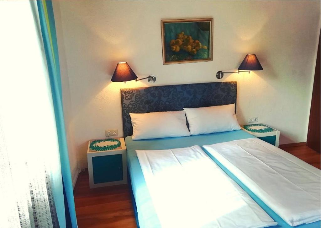 Postel nebo postele na pokoji v ubytování Hotel Pfaff