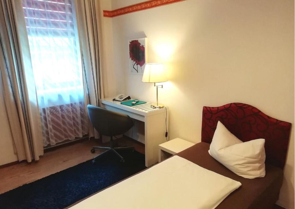 Postel nebo postele na pokoji v ubytování Hotel Pfaff