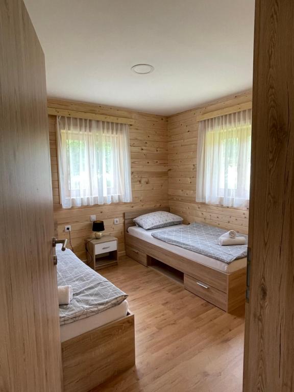 Postel nebo postele na pokoji v ubytování Martinova izba - Family Bungalows