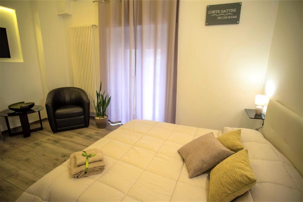 Postel nebo postele na pokoji v ubytování Corte Gattini Rooms