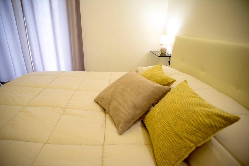 Postel nebo postele na pokoji v ubytování Corte Gattini Rooms