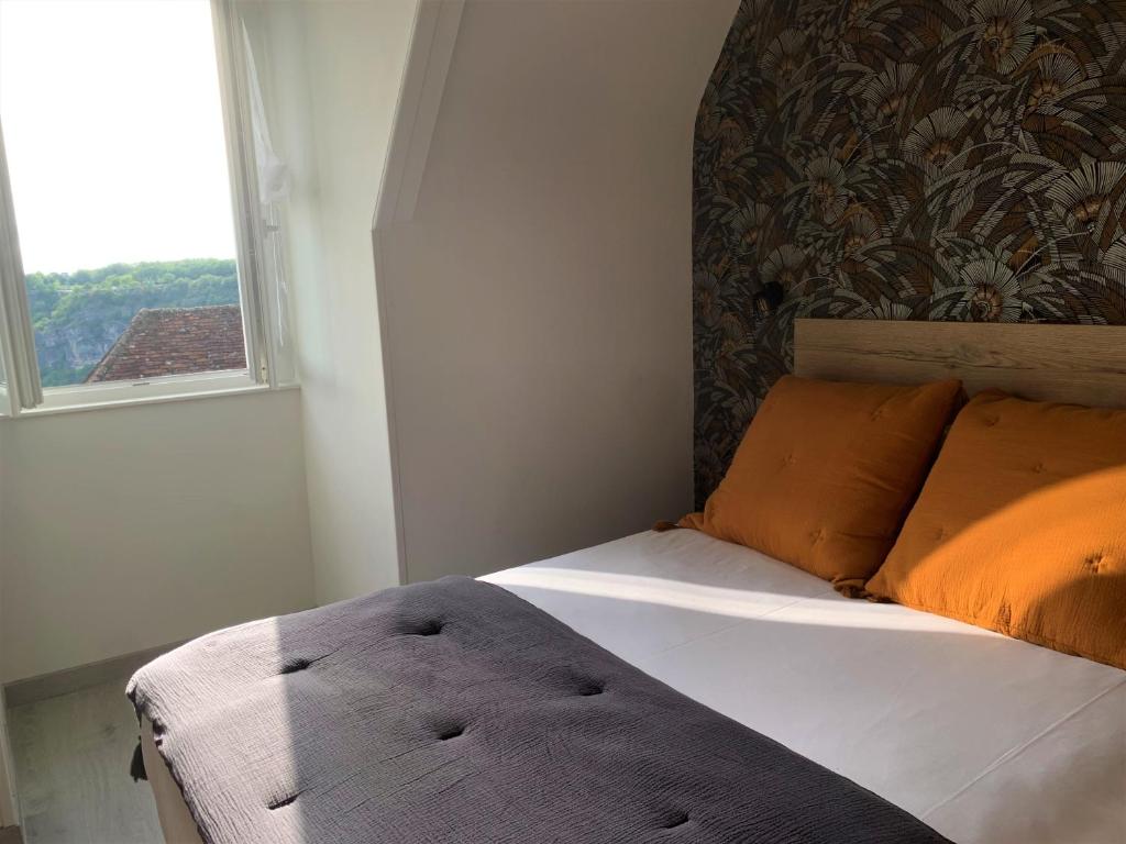 Postel nebo postele na pokoji v ubytování Hostellerie Bellevue
