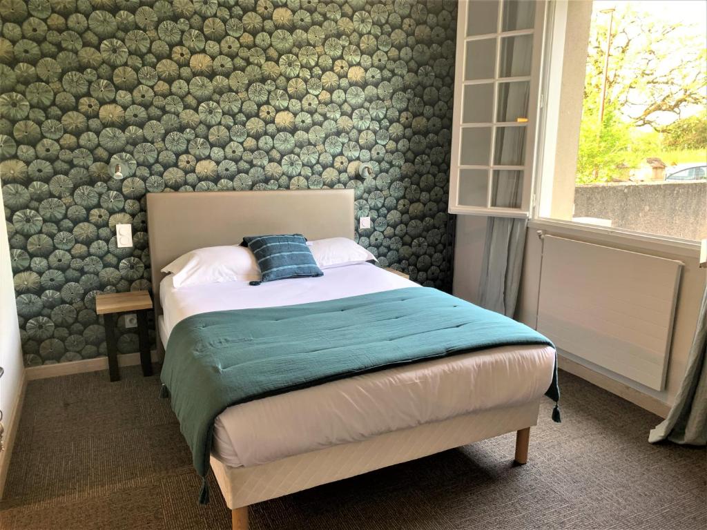 Postel nebo postele na pokoji v ubytování Hostellerie Bellevue