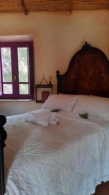 Postel nebo postele na pokoji v ubytování holiday home su Niberalzu