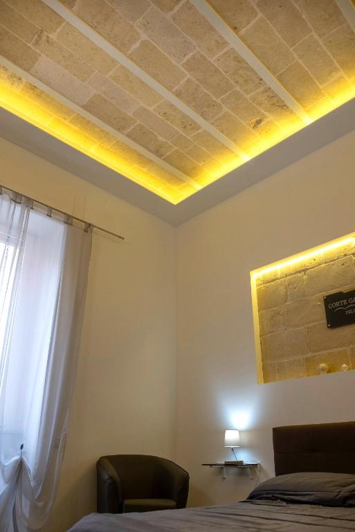 Postel nebo postele na pokoji v ubytování Corte Gattini Rooms