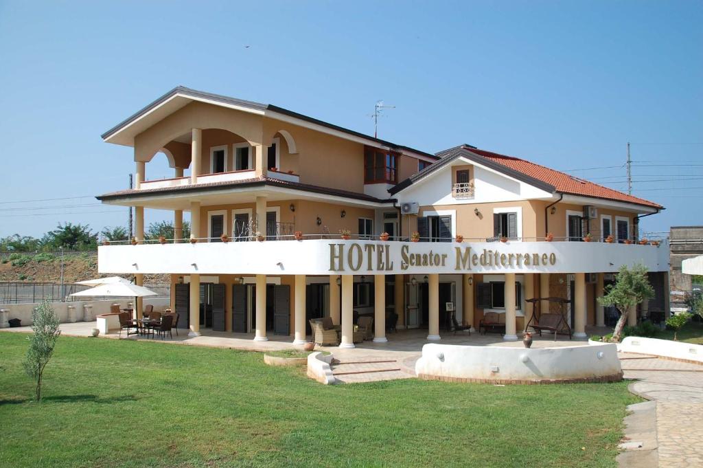a building with a sign that reads houston senior marriott at Hotel Villa Senator Mediterraneo in Tortora