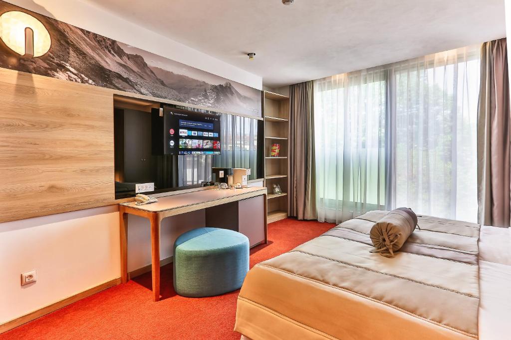 Letto o letti in una camera di Carine Hotel Centar