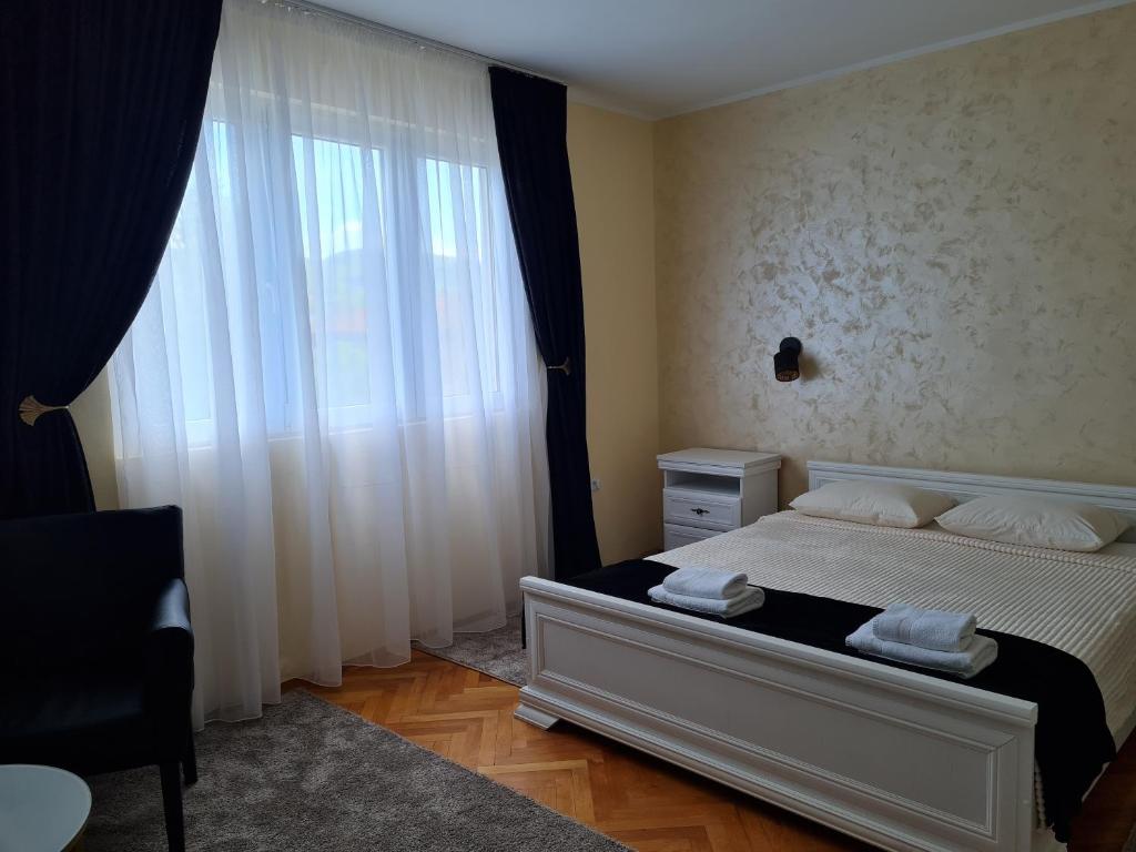 Кровать или кровати в номере Apartman Trifunović