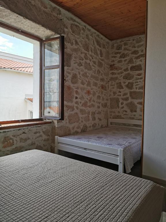 Łóżko lub łóżka w pokoju w obiekcie Apartman Blaslov Kali