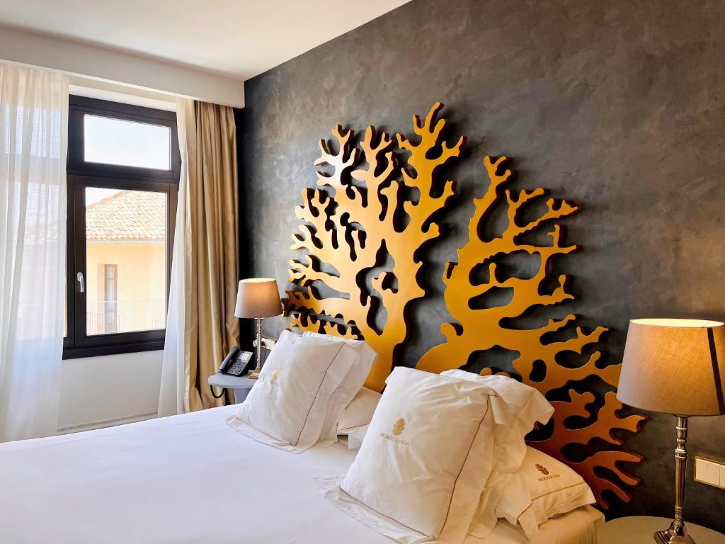 Postel nebo postele na pokoji v ubytování Hotel Palacio De Úbeda 5 G.L