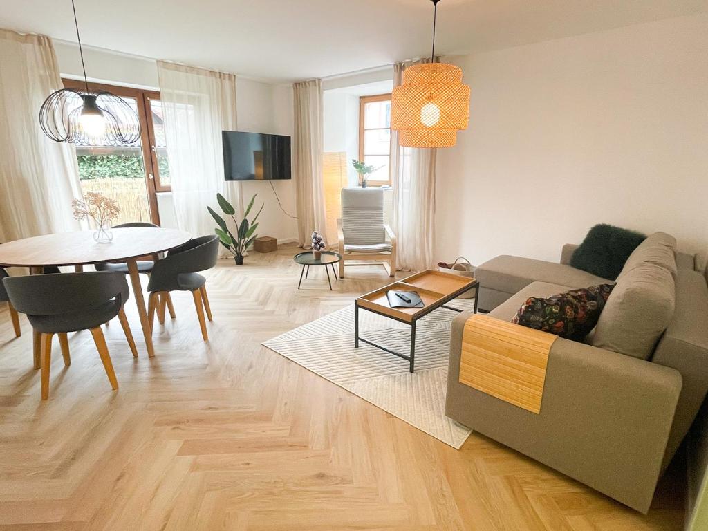 a living room with a couch and a table at Ferienwohnung Ava No3- Heiligkreuztal 2-3 Personen in Heiligkreuztal
