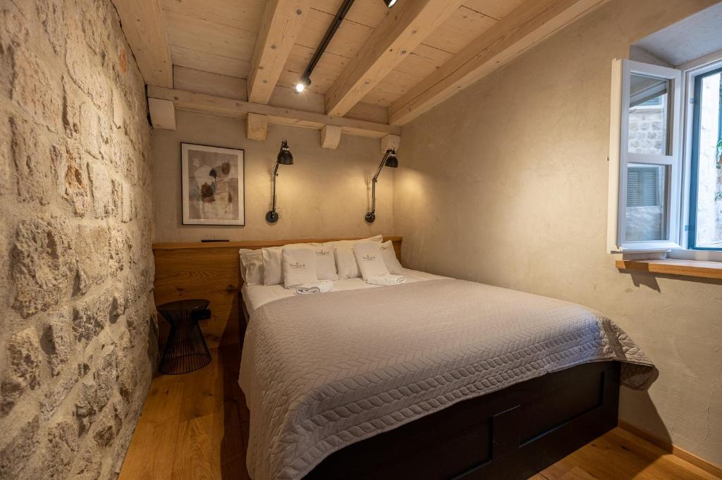 Posteľ alebo postele v izbe v ubytovaní Superior 1 BR Apartment Gabriela next to Buža beach