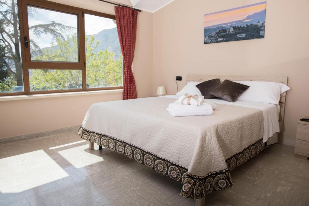 A bed or beds in a room at Divino Bistrot e Relais