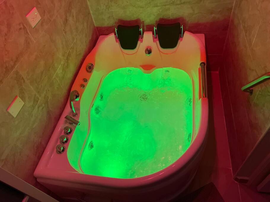 a bath tub with a tub with sunglasses on it at Palmas View Premium 6 in Humacao