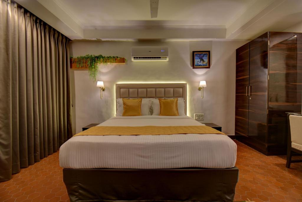 Postel nebo postele na pokoji v ubytování Elite Hotel