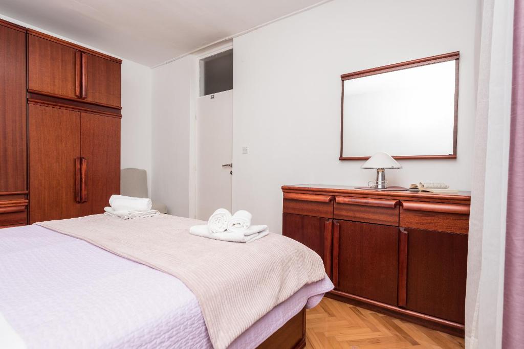 Posteľ alebo postele v izbe v ubytovaní Apartman Centar Glavaš