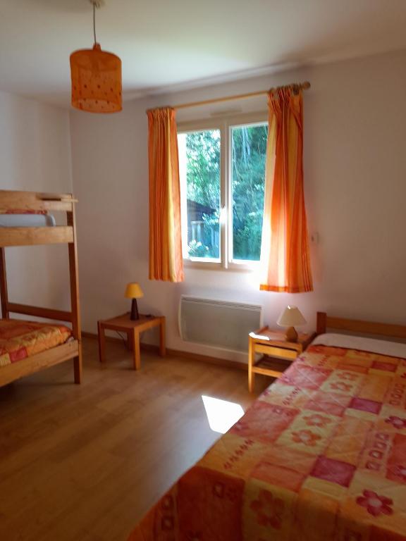 Postel nebo postele na pokoji v ubytování Gites du Quié