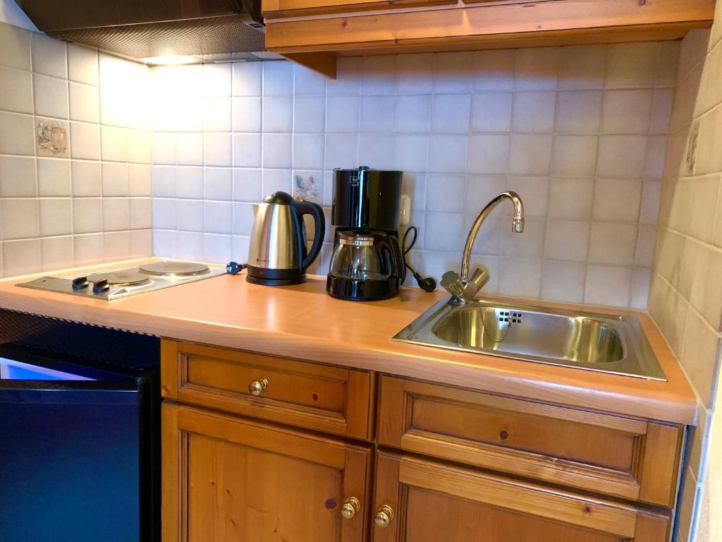 Kuchyň nebo kuchyňský kout v ubytování Alpenrose Appartements