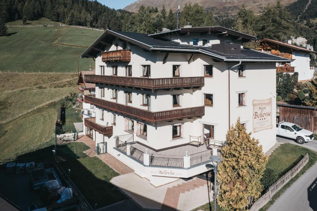 an aerial view of a large white building at Haus Bellevue by VAYA in Serfaus