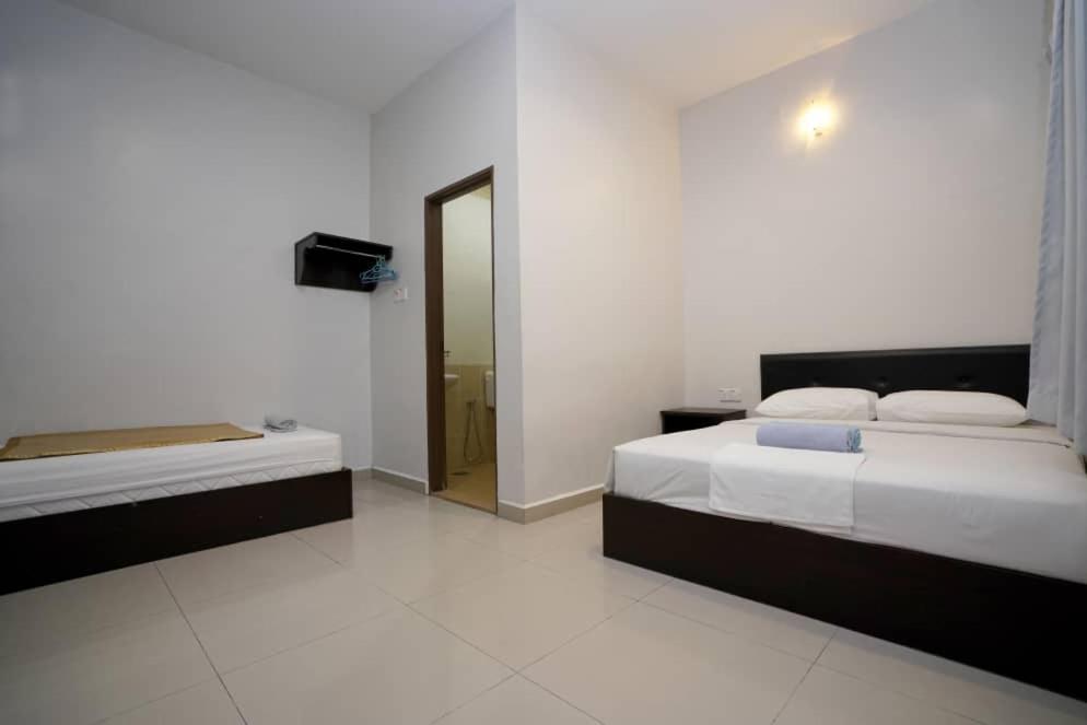 Postel nebo postele na pokoji v ubytování CK Hotel