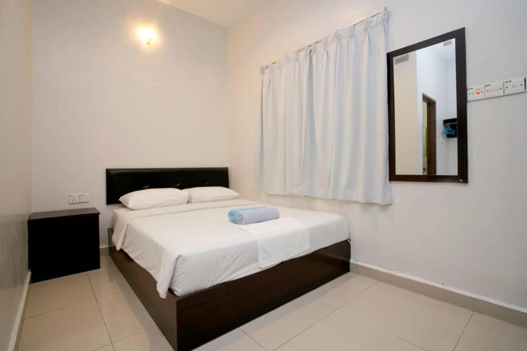 Postel nebo postele na pokoji v ubytování CK Hotel