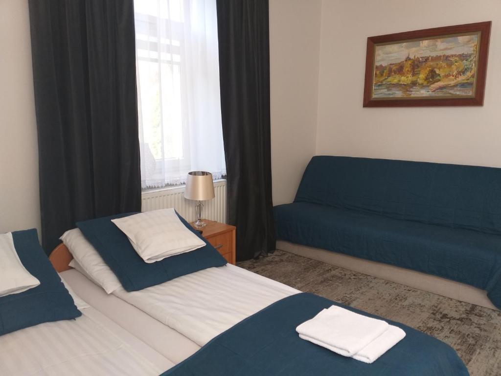 Posteľ alebo postele v izbe v ubytovaní Apartamenty i pokoje gościnne KOŁODZIEJÓWKA
