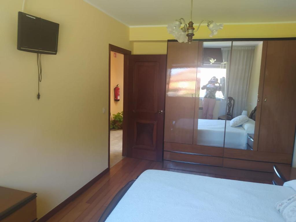 A bed or beds in a room at Casa Sopeña