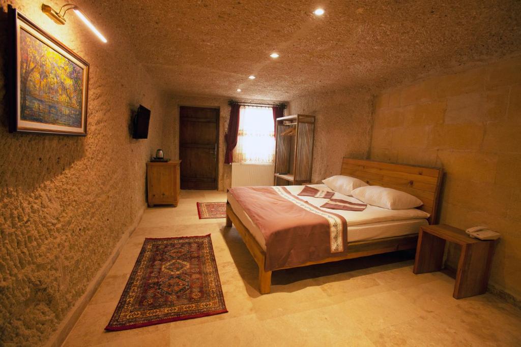 Postel nebo postele na pokoji v ubytování Narcissos Cave