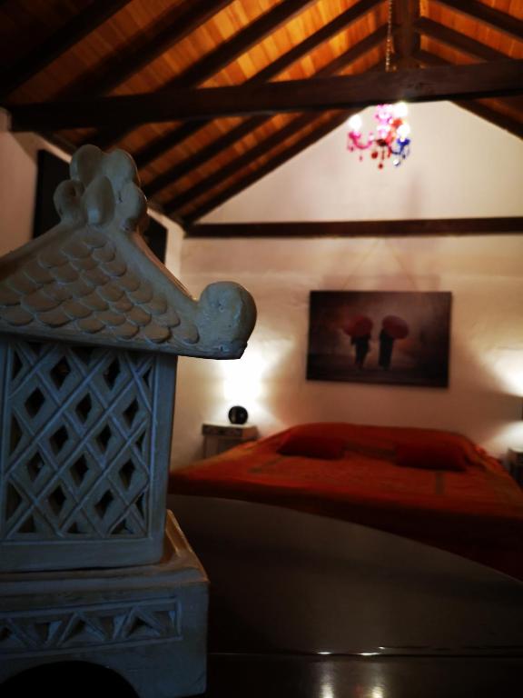 Postel nebo postele na pokoji v ubytování Suite Zen y Cueva Refugio