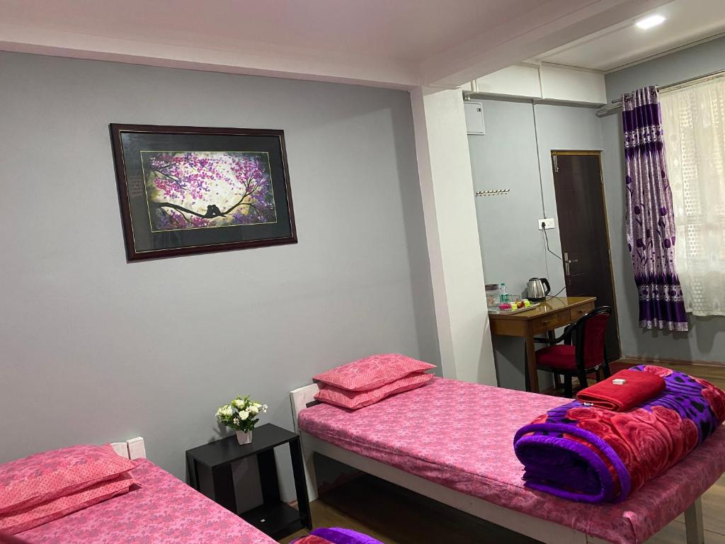 Postel nebo postele na pokoji v ubytování JAN Homestay Shillong