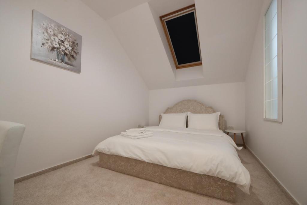 Postel nebo postele na pokoji v ubytování Perla Sudului - Residence