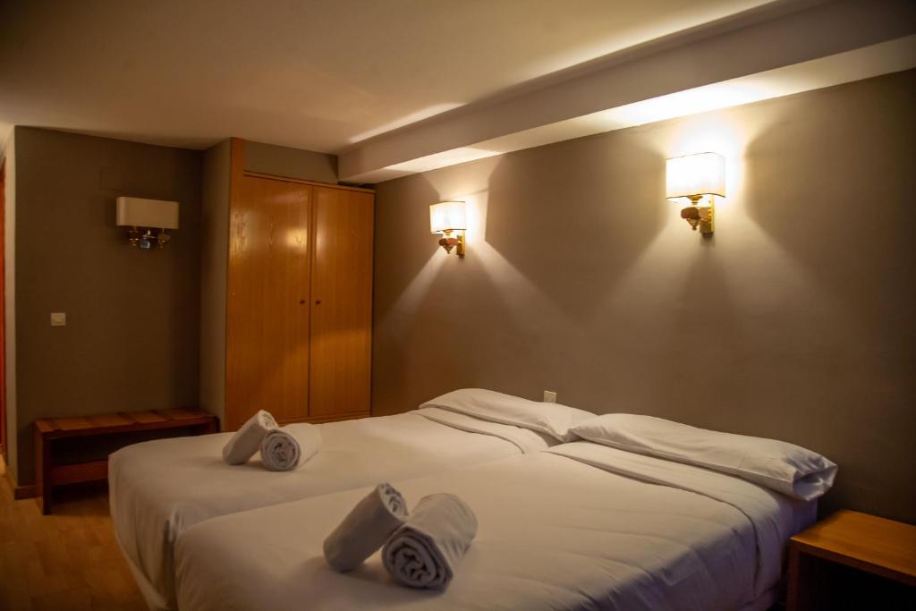 Postel nebo postele na pokoji v ubytování Pic Maià Mountain Hotel