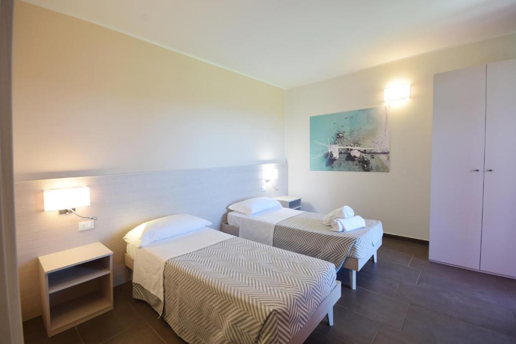 Posteľ alebo postele v izbe v ubytovaní Hotel La Siesta