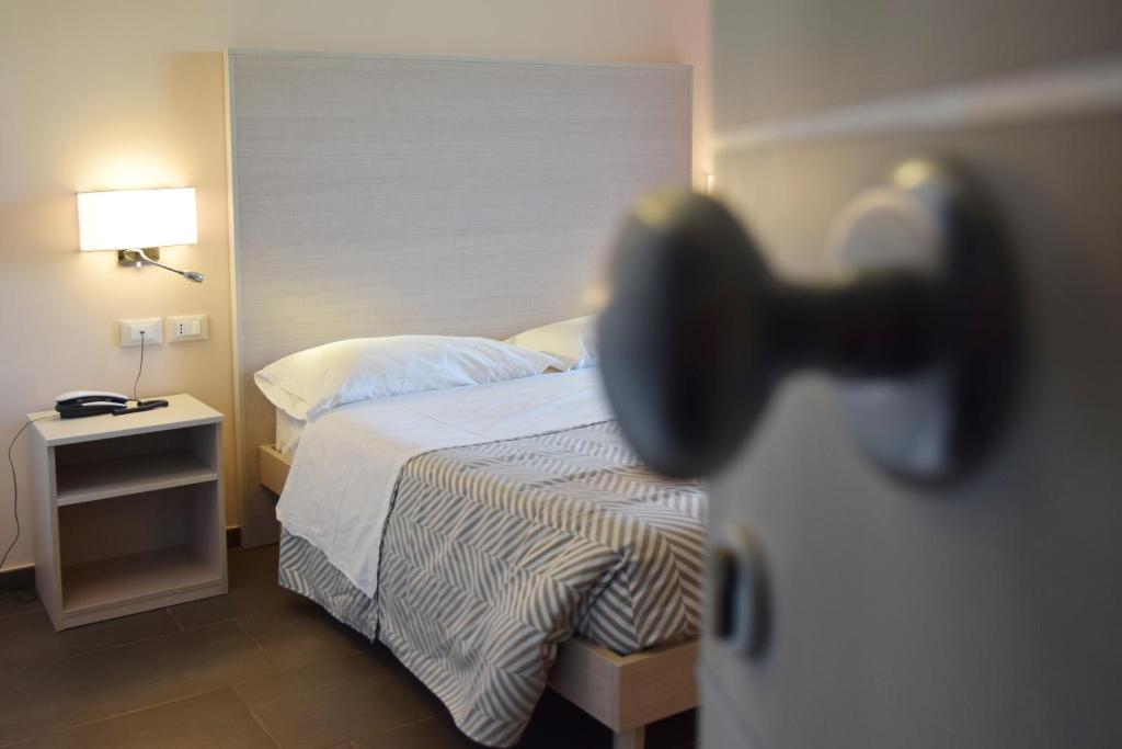 Posteľ alebo postele v izbe v ubytovaní Hotel La Siesta