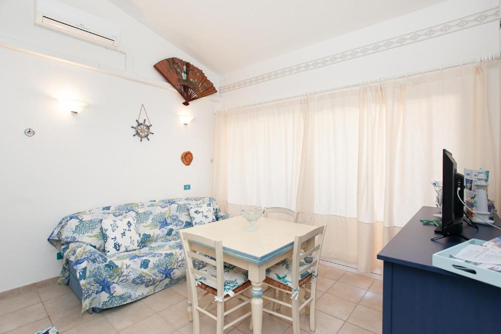 Posedenie v ubytovaní Porto Coda Cavallo Beach House a 300 mt dal mare, con terrazza panoramica