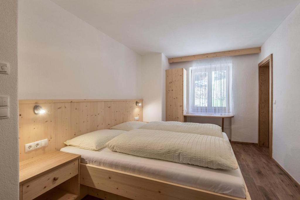 Postel nebo postele na pokoji v ubytování Thusnelda Apartment B
