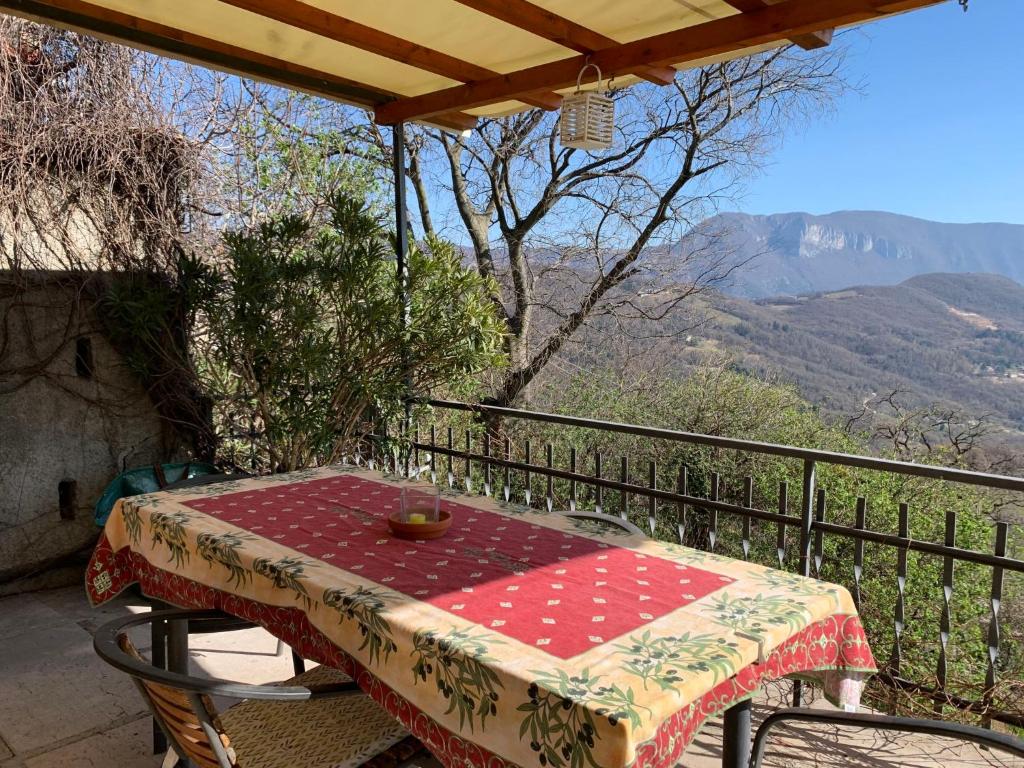a table and chairs on a balcony with a view at Holiday Home Casa Susanne by Interhome in Spiazzi Di Caprino
