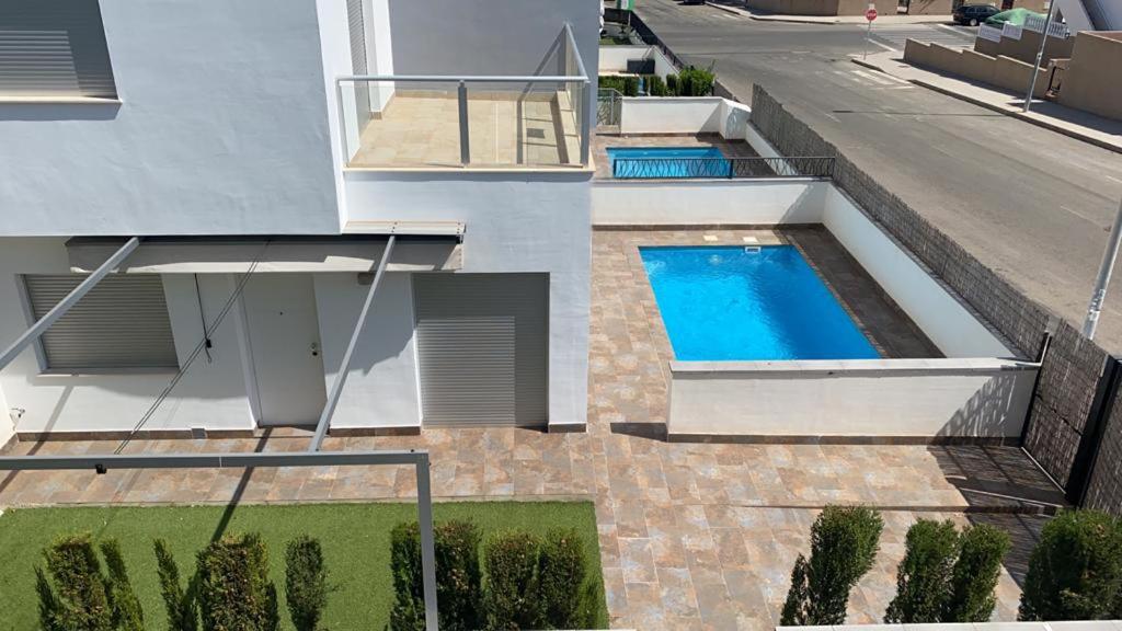 an external view of a house with a swimming pool at Villa Luxury - Private Pool - Wifi - Solarium in Alicante