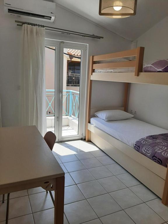Postel nebo postele na pokoji v ubytování Ionian Apartment, Sami