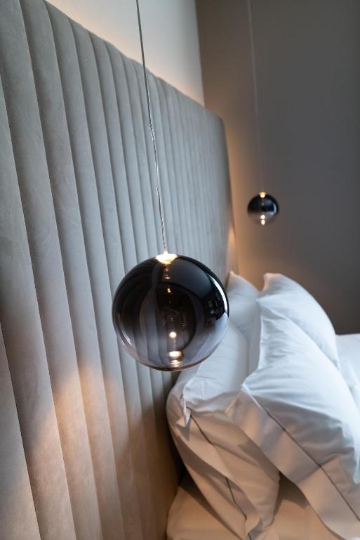 Postel nebo postele na pokoji v ubytování 3T Boutique Hotel