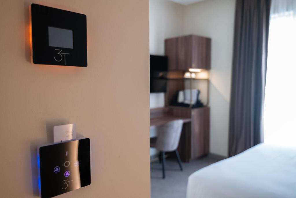 Postel nebo postele na pokoji v ubytování 3T Boutique Hotel