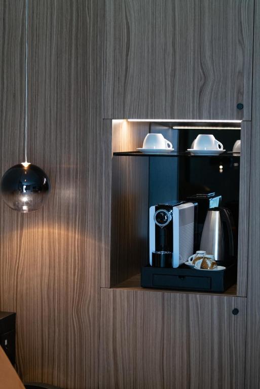 Příslušenství pro přípravu čaje a kávy v ubytování 3T Boutique Hotel