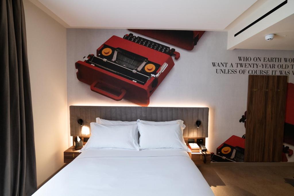 Postel nebo postele na pokoji v ubytování 3T Boutique Hotel