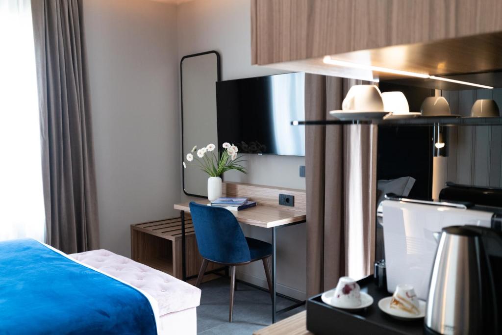 Postel nebo postele na pokoji v ubytování 3T Boutique Hotel