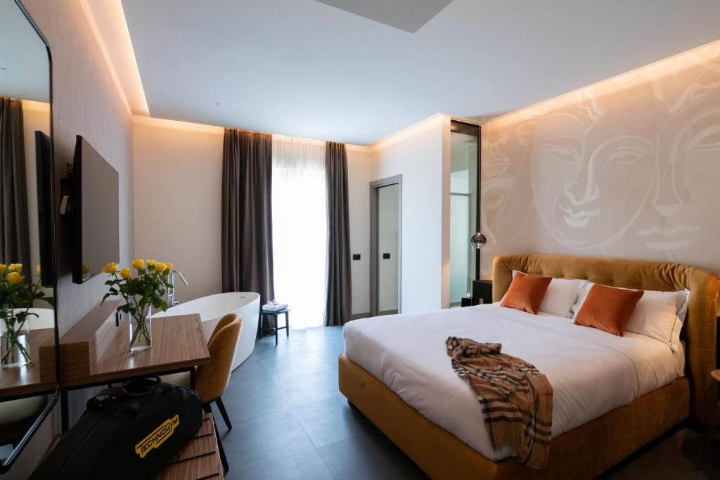 Postel nebo postele na pokoji v ubytování 3T Boutique Hotel