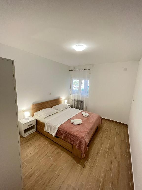 Posteľ alebo postele v izbe v ubytovaní Apartman Maša