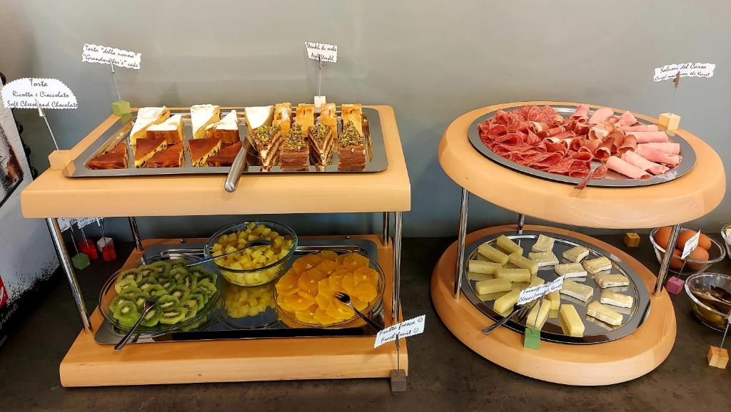 a buffet with different types of food on display at Hotel Aurora Duino in Duino