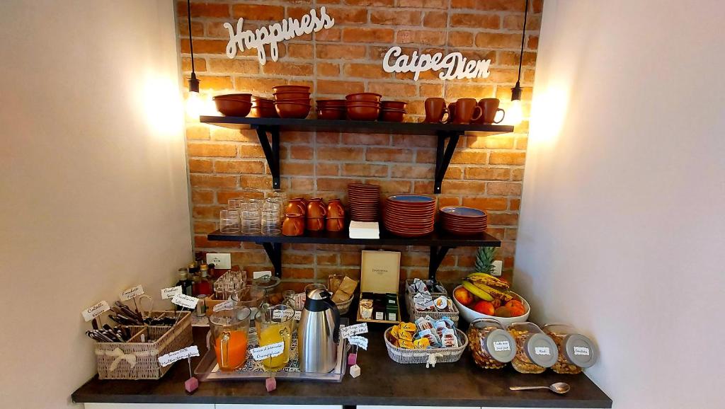 a counter with a bunch of food on it at Hotel Aurora Duino in Duino