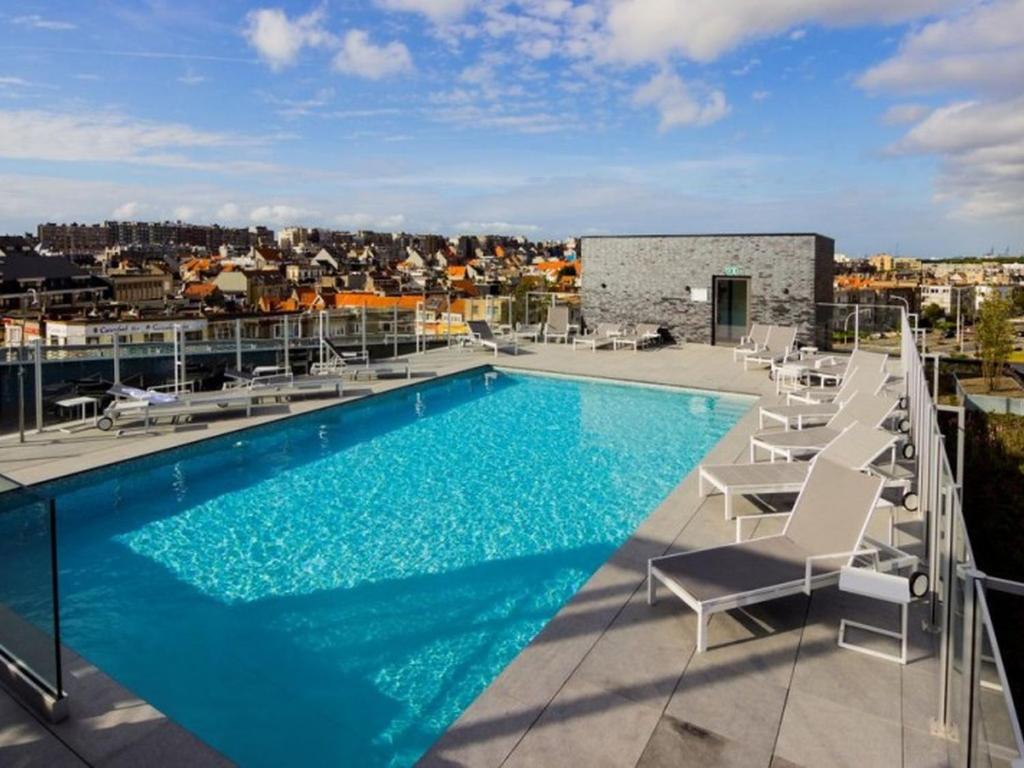 a swimming pool on the roof of a building at Apartment Railway to the Beach with balcony by Interhome in Blankenberge