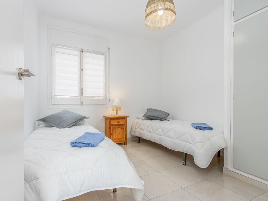 Posteľ alebo postele v izbe v ubytovaní Apartment Flamicell by Interhome